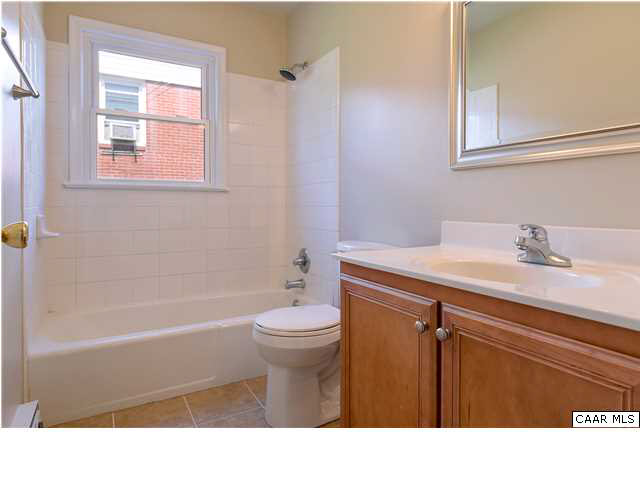1310 River Road Charlottesville, VA 22901 - Photo 12 of 22 Full bath with tiled tub/shower. New tub Delta faucet, ceramic tiled flooring and new toilet.