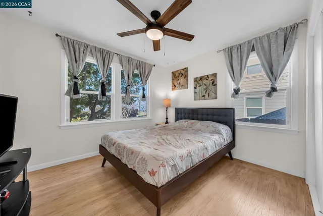 a bedroom with a large bed and a window