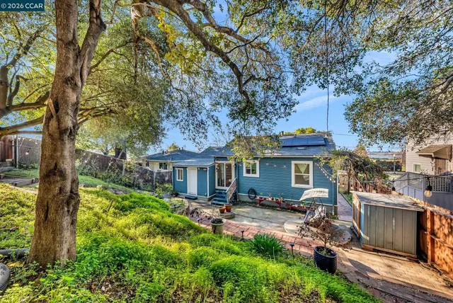 a front view of a house with a yard table and chairs