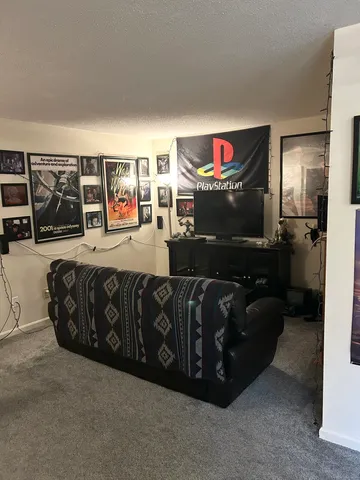 a living room with furniture and a flat screen tv
