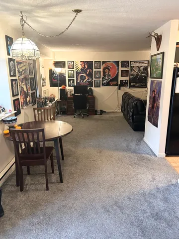 a view of a livingroom with furniture and window