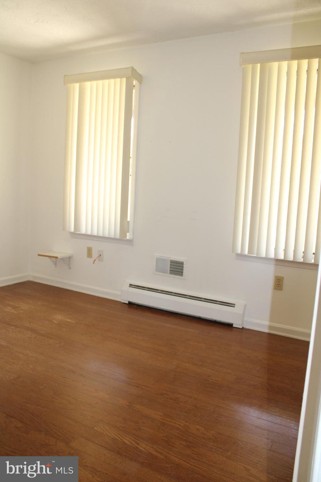 2485 Joppa Road York, PA 17403 - Photo 6 of 14 an empty room with wooden floor and windows