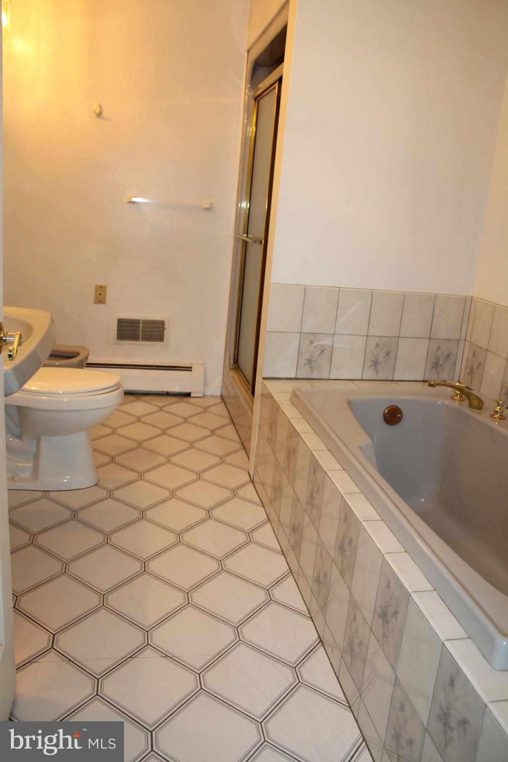 2485 Joppa Road York, PA 17403 - Photo 10 of 14 a bathroom with a bathtub and a toilet