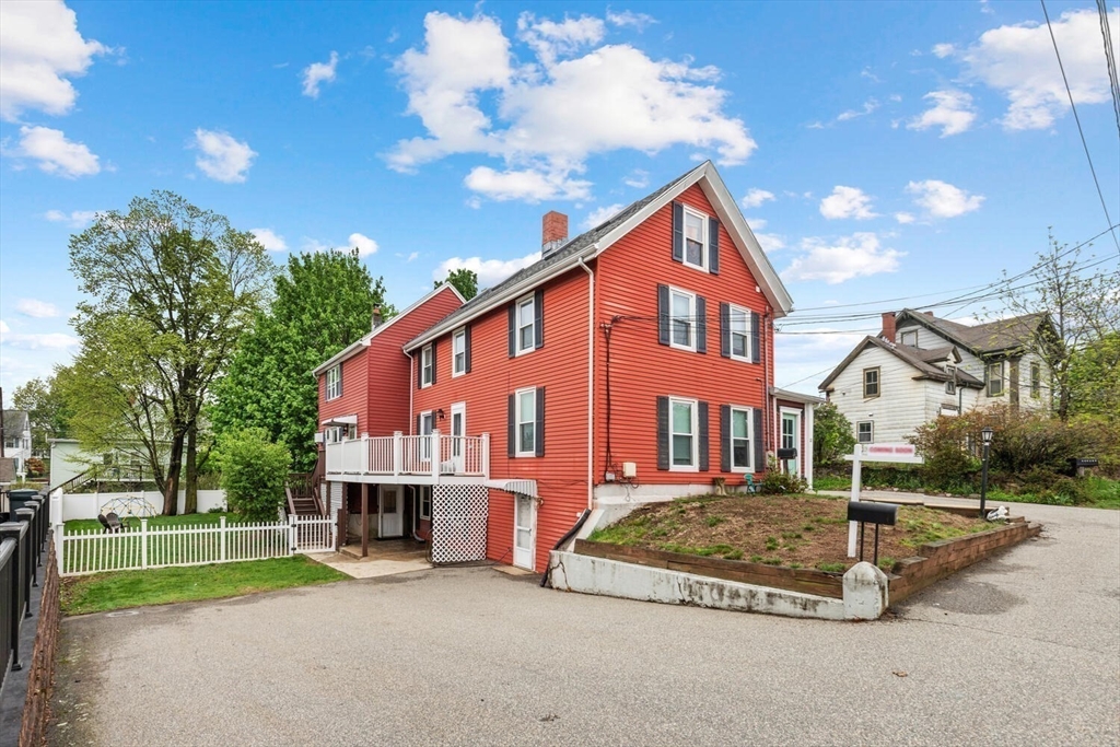 12 Wright Street, Unit 2 Stoneham, MA 02180 - Photo 1 of 35 a view of a house with a yard porch and sitting area