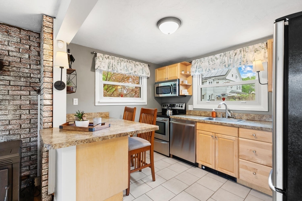 12 Wright Street, Unit 2 Stoneham, MA 02180 - Photo 15 of 35 a kitchen that has a sink and a stove in it