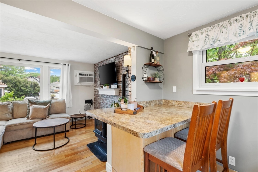 12 Wright Street, Unit 2 Stoneham, MA 02180 - Photo 18 of 35 a living room with furniture and a flat screen tv