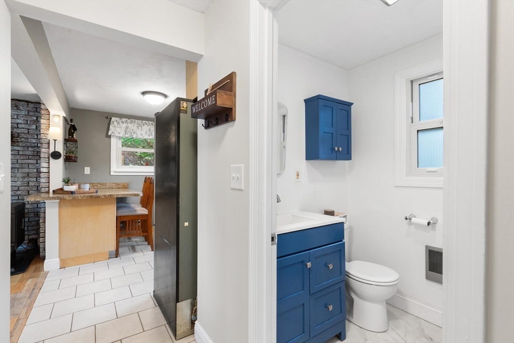 12 Wright Street, Unit 2 Stoneham, MA 02180 - Photo 21 of 35 a bathroom with a toilet sink and mirror