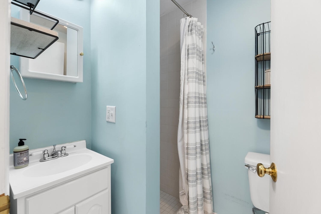 12 Wright Street, Unit 2 Stoneham, MA 02180 - Photo 24 of 35 a bathroom with a sink toilet and shower
