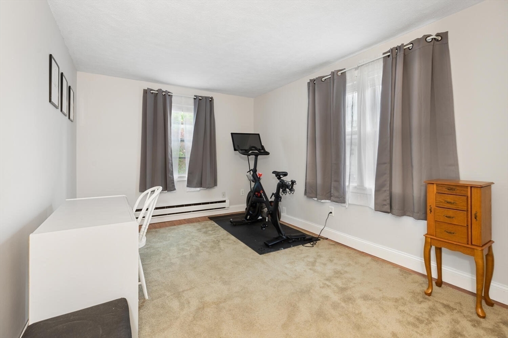 12 Wright Street, Unit 2 Stoneham, MA 02180 - Photo 29 of 35 a room with a bed and a window