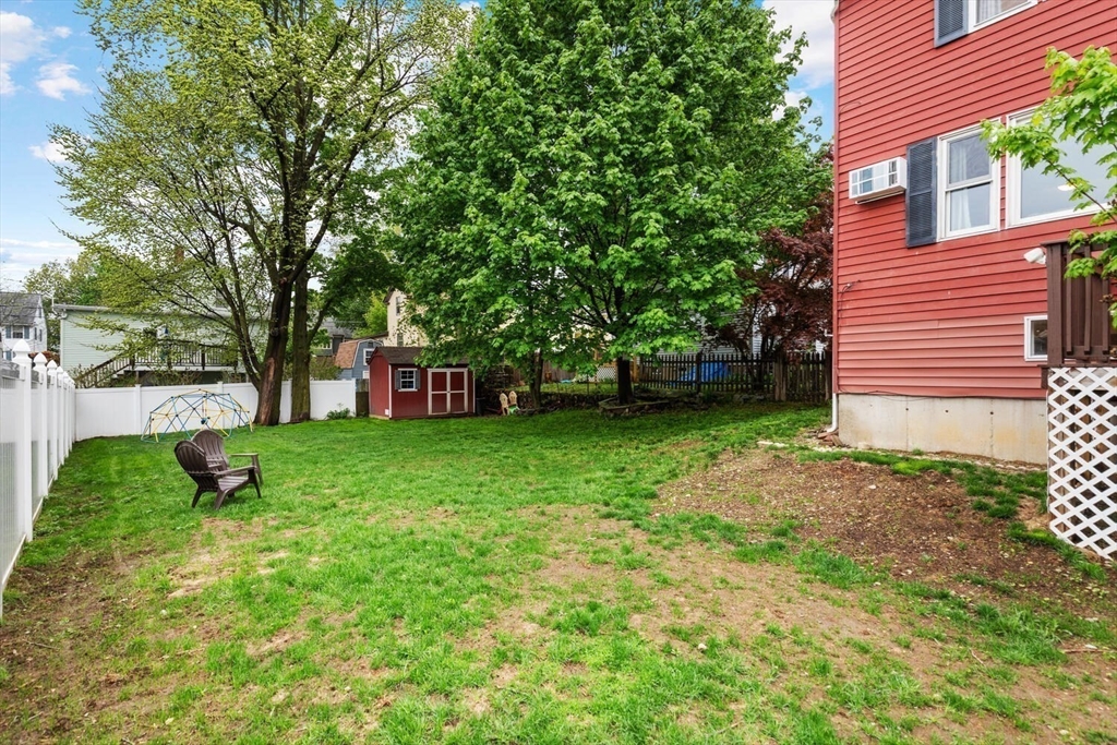 12 Wright Street, Unit 2 Stoneham, MA 02180 - Photo 4 of 35 a view of a backyard with a garden
