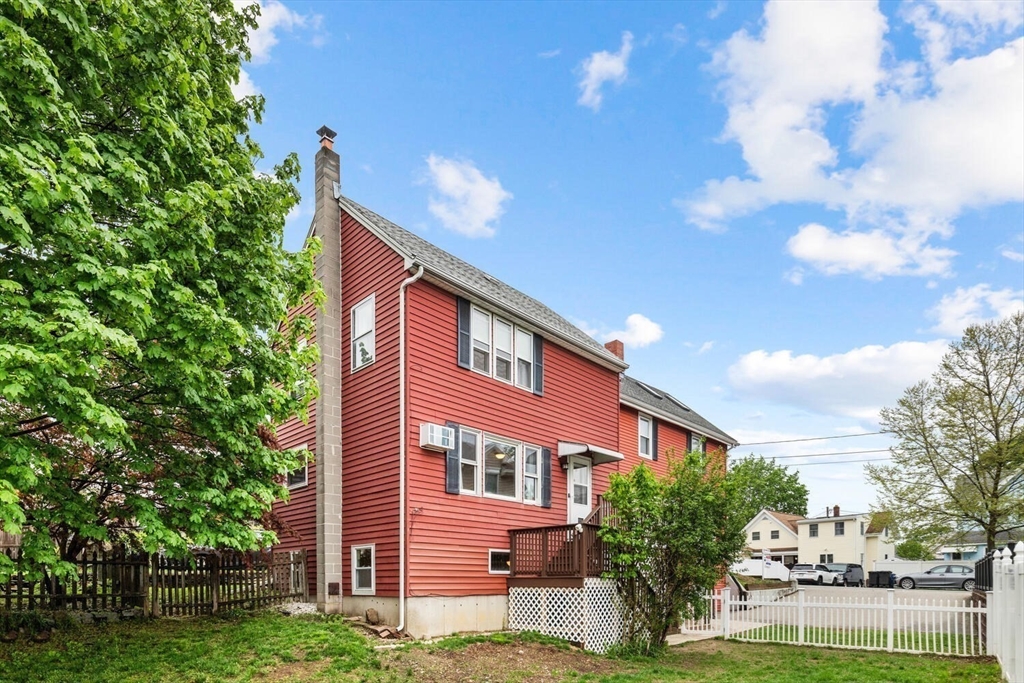 12 Wright Street, Unit 2 Stoneham, MA 02180 - Photo 5 of 35 a front view of a house with a yard