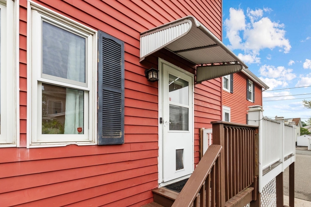 12 Wright Street, Unit 2 Stoneham, MA 02180 - Photo 6 of 35 a view of a house with wooden fence