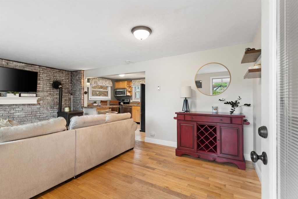 12 Wright Street, Unit 2 Stoneham, MA 02180 - Photo 8 of 35 a living room with furniture and a wooden floor