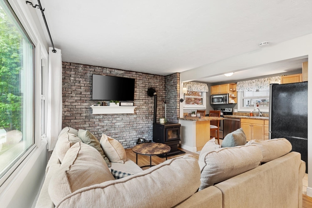 12 Wright Street, Unit 2 Stoneham, MA 02180 - Photo 10 of 35 a living room with furniture and a flat screen tv