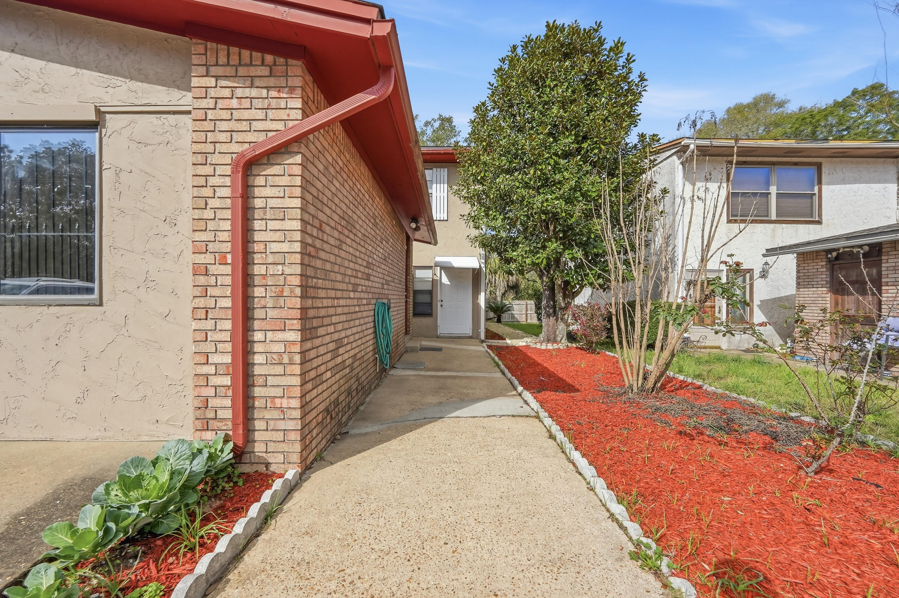 41 12th Street, Unit 68 Shalimar, FL 32579 - Photo 1 of 32 a view of a backyard with sitting area