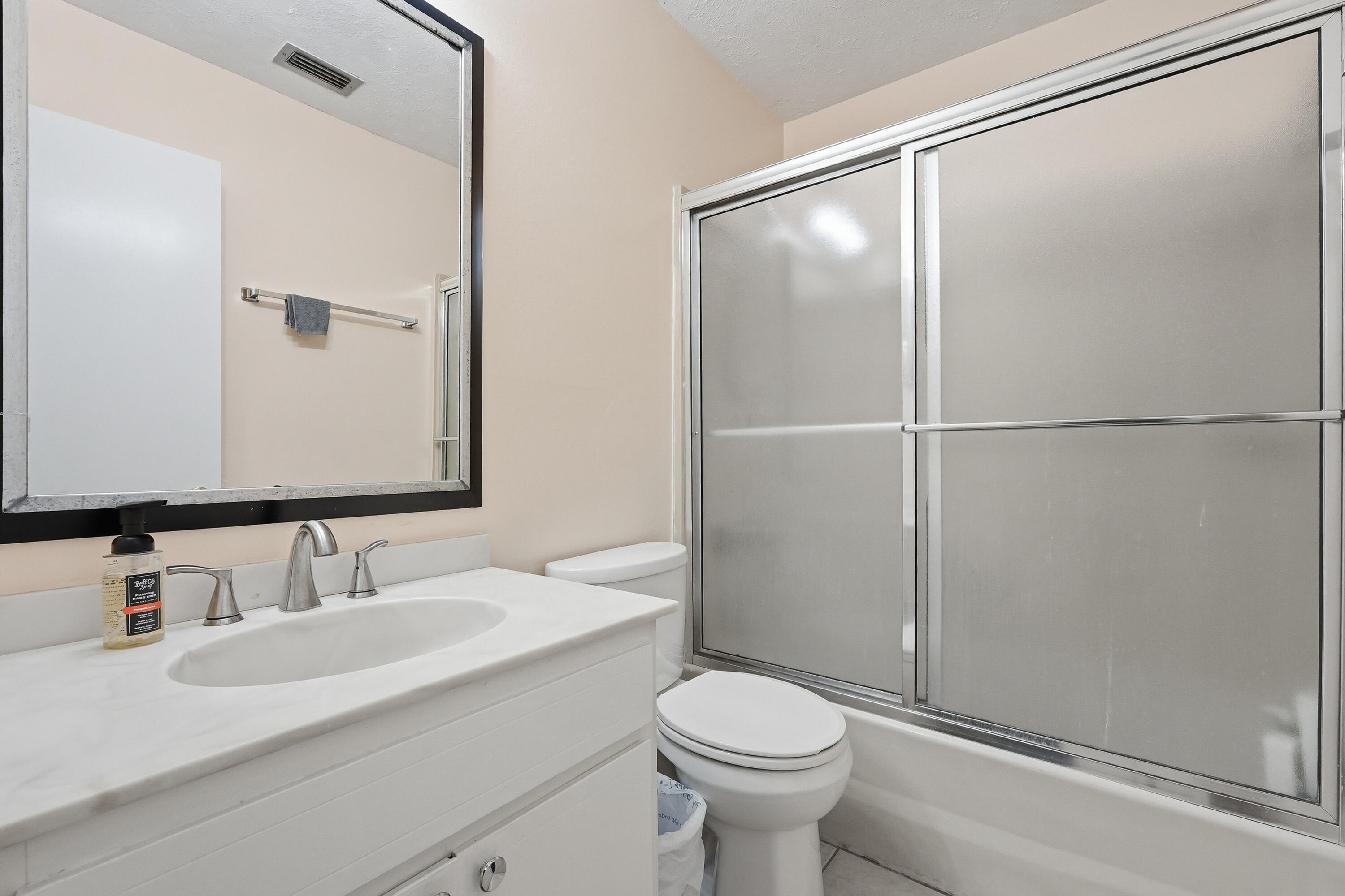 41 12th Street, Unit 68 Shalimar, FL 32579 - Photo 18 of 32 a bathroom with a sink and a mirror