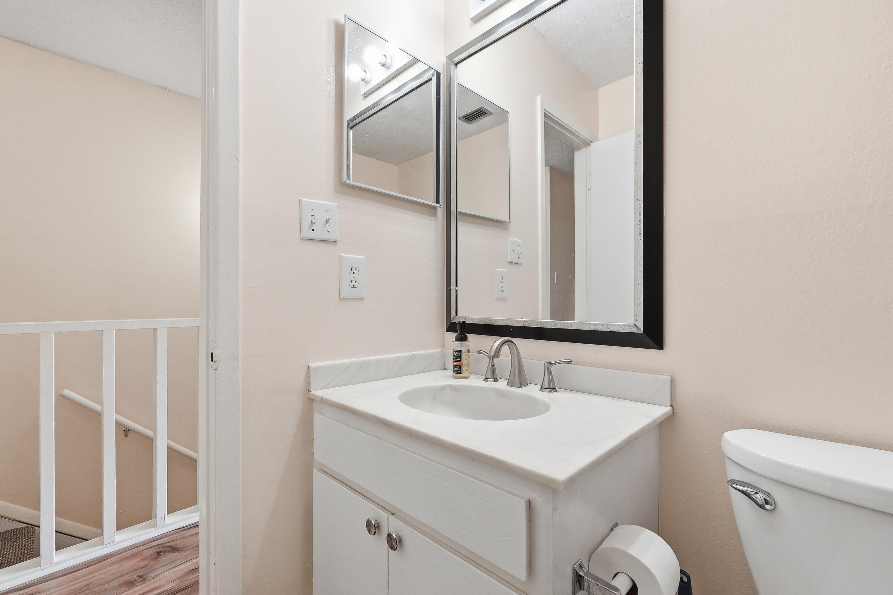 41 12th Street, Unit 68 Shalimar, FL 32579 - Photo 19 of 32 a bathroom with a sink toilet and mirror