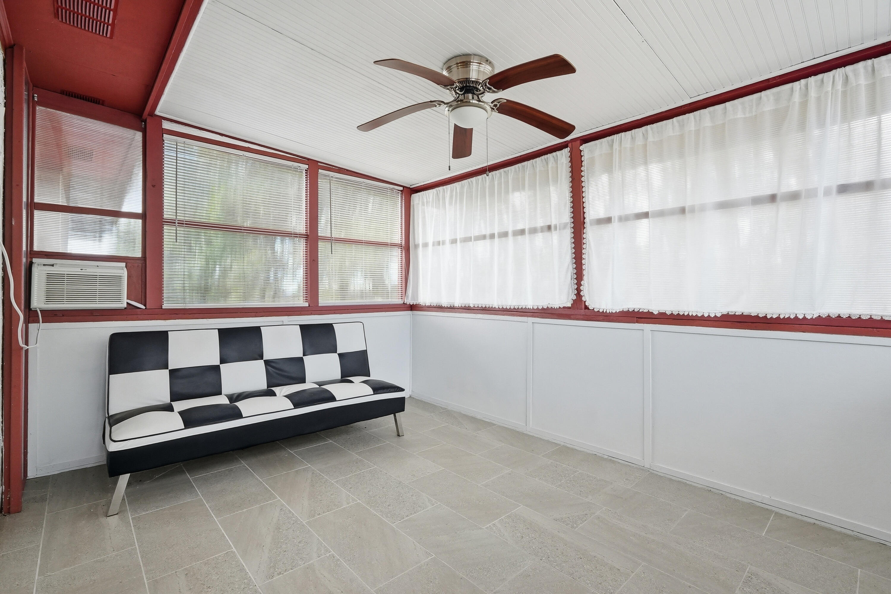41 12th Street, Unit 68 Shalimar, FL 32579 - Photo 22 of 32 a bathroom with a large window and a chandelier