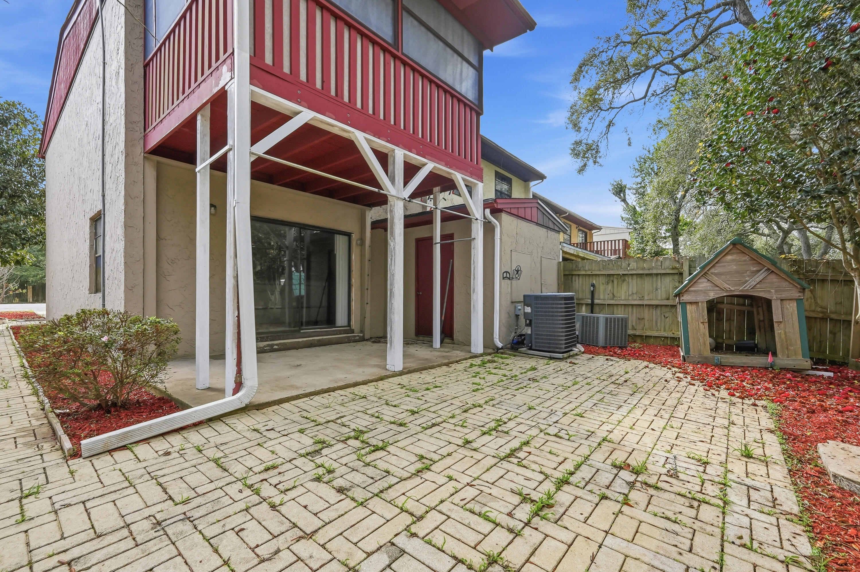 41 12th Street, Unit 68 Shalimar, FL 32579 - Photo 30 of 32 a view of a house with wooden fence
