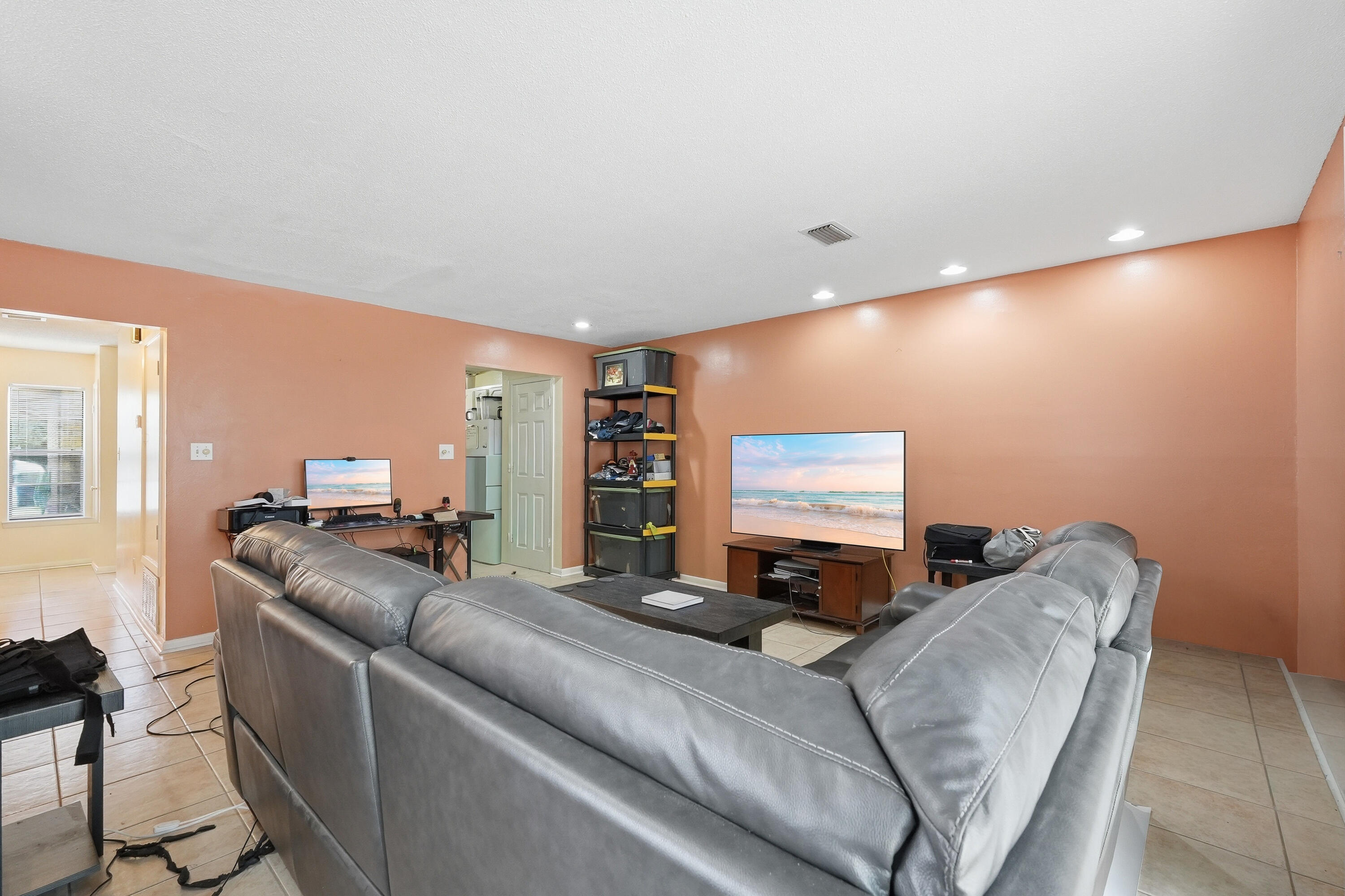 41 12th Street, Unit 68 Shalimar, FL 32579 - Photo 9 of 32 a living room with furniture and a flat screen tv