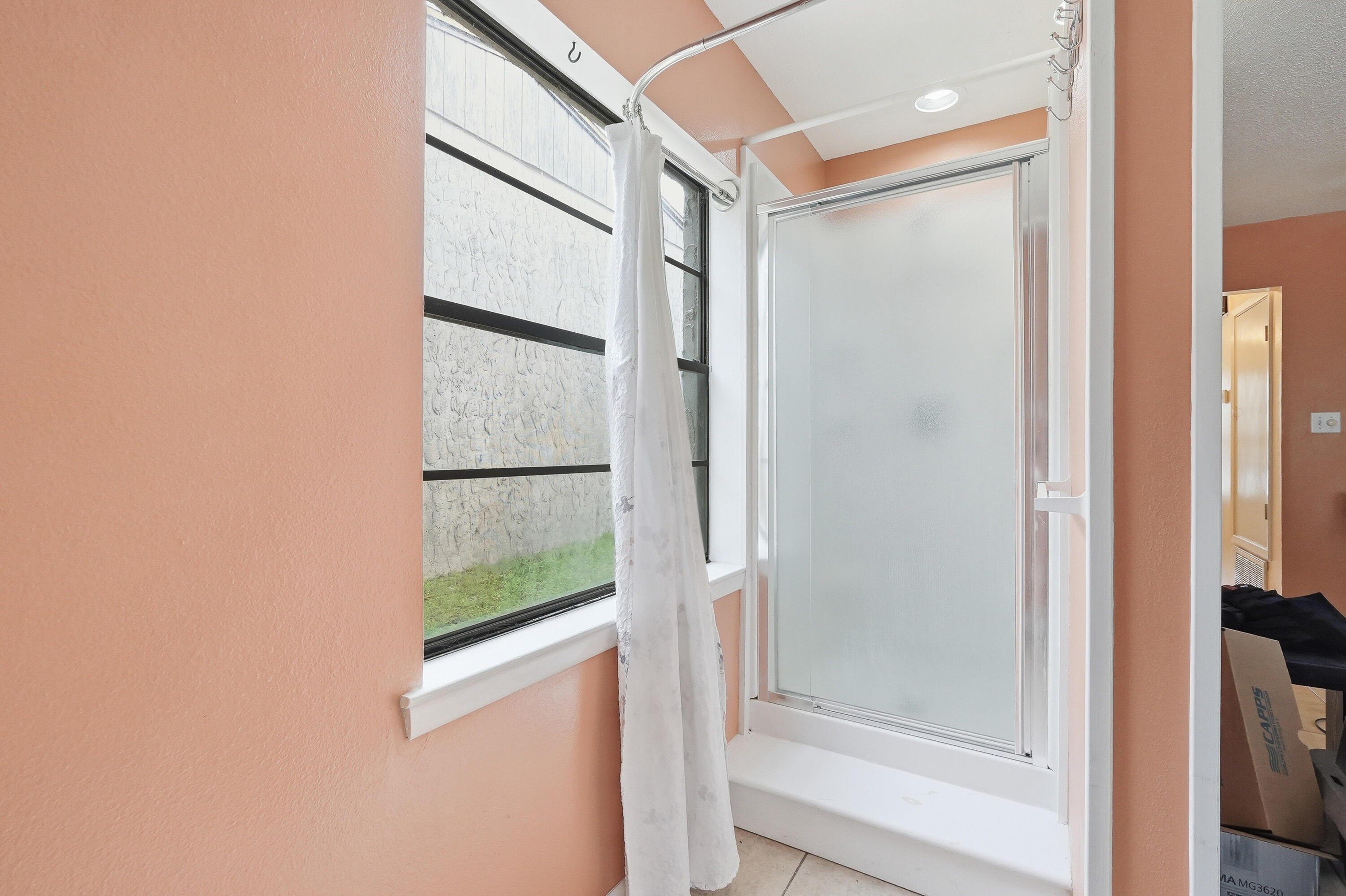 41 12th Street, Unit 68 Shalimar, FL 32579 - Photo 10 of 32 a bathroom with a glass shower door