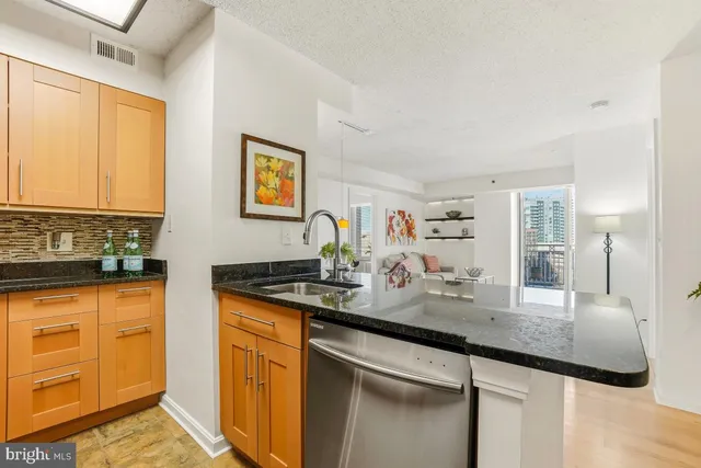 a kitchen with sink cabinets and window