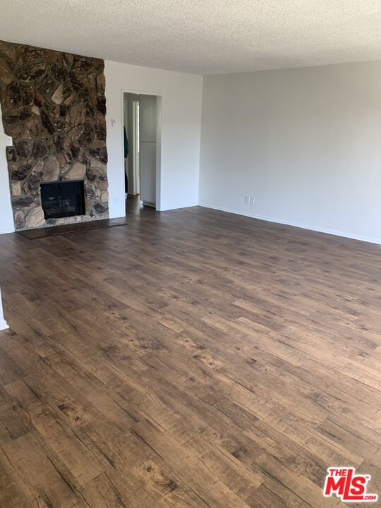 11525 Rochester Avenue, Unit 204 Los Angeles, CA 90025 - Photo 6 of 8 a view of an empty room and fire place