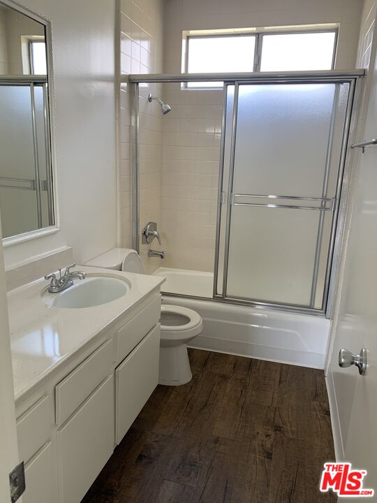 11525 Rochester Avenue, Unit 204 Los Angeles, CA 90025 - Photo 8 of 8 a bathroom with a sink toilet and shower