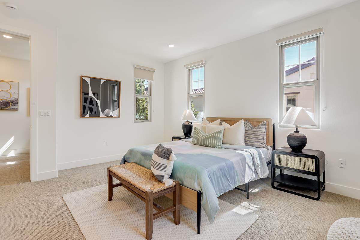 14 Catania Common Fremont, CA 94536 - Photo 19 of 39 a spacious bedroom with a bed and a couch