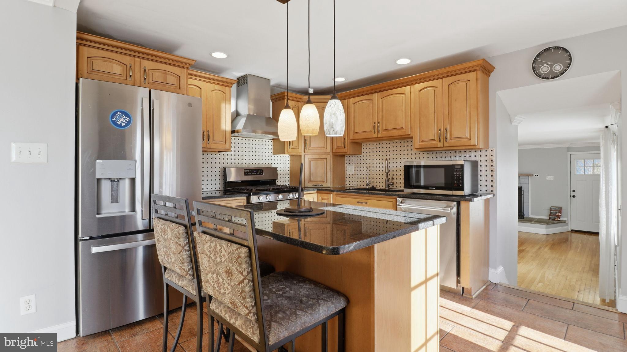 1703 Tioga Road Fort Washington, MD 20744 - Photo 16 of 57 Modern kitchen with warm wood accents.