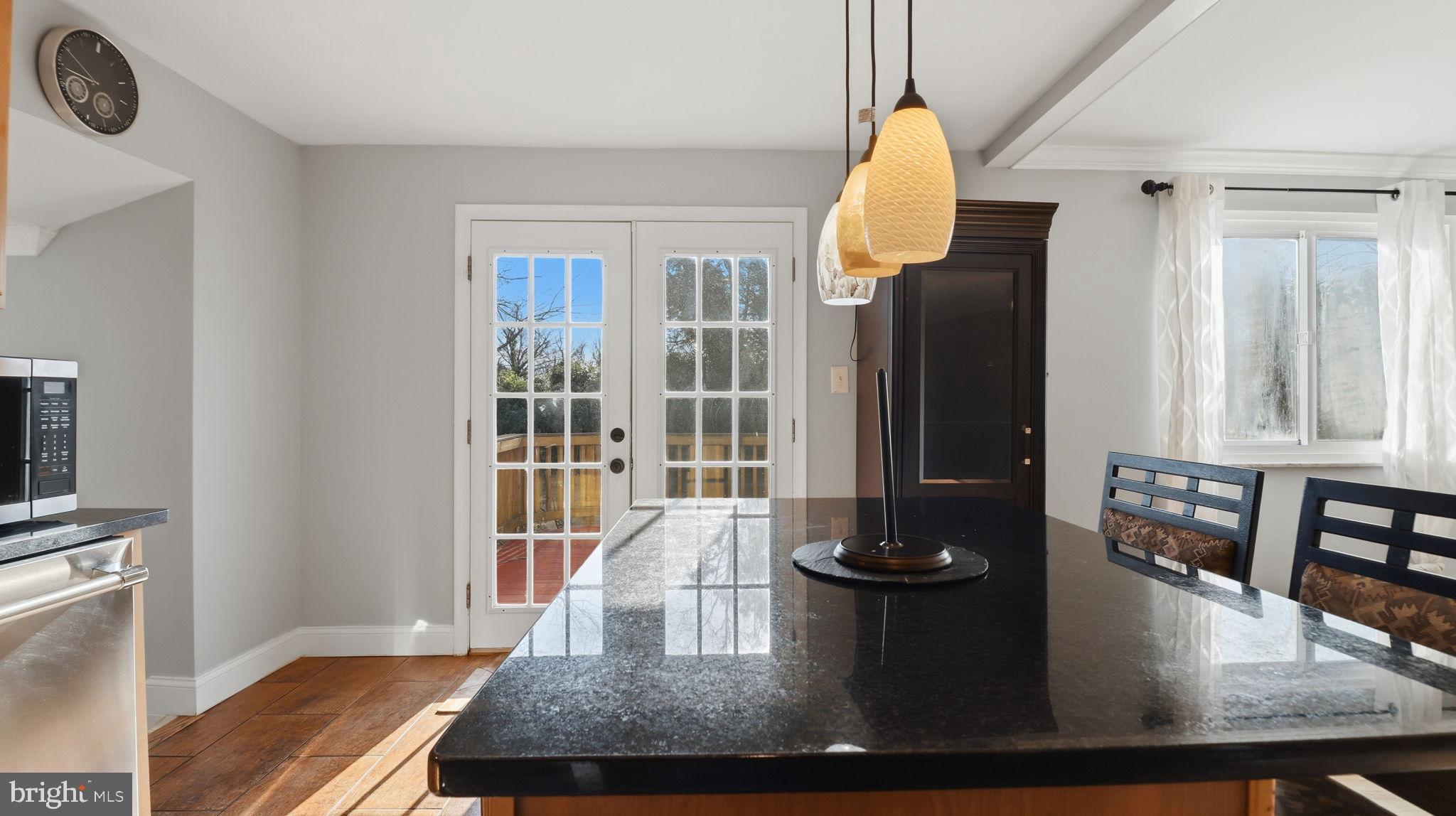 1703 Tioga Road Fort Washington, MD 20744 - Photo 19 of 57 Bright kitchen with elegant black countertops.
