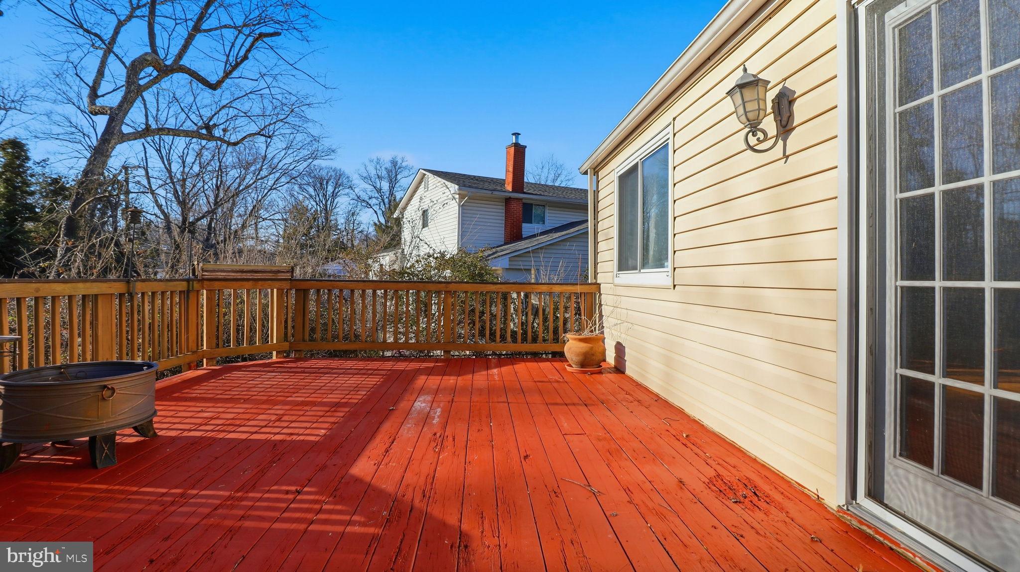 1703 Tioga Road Fort Washington, MD 20744 - Photo 20 of 57 Sunny deck with vibrant red flooring.