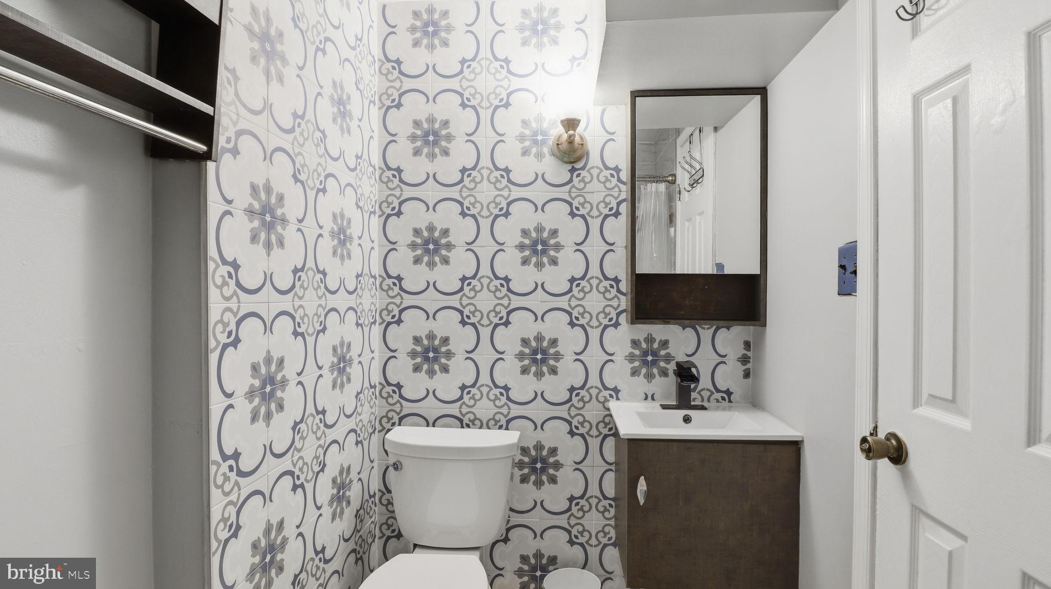 1703 Tioga Road Fort Washington, MD 20744 - Photo 42 of 57 Charming bathroom with decorative tile accents.