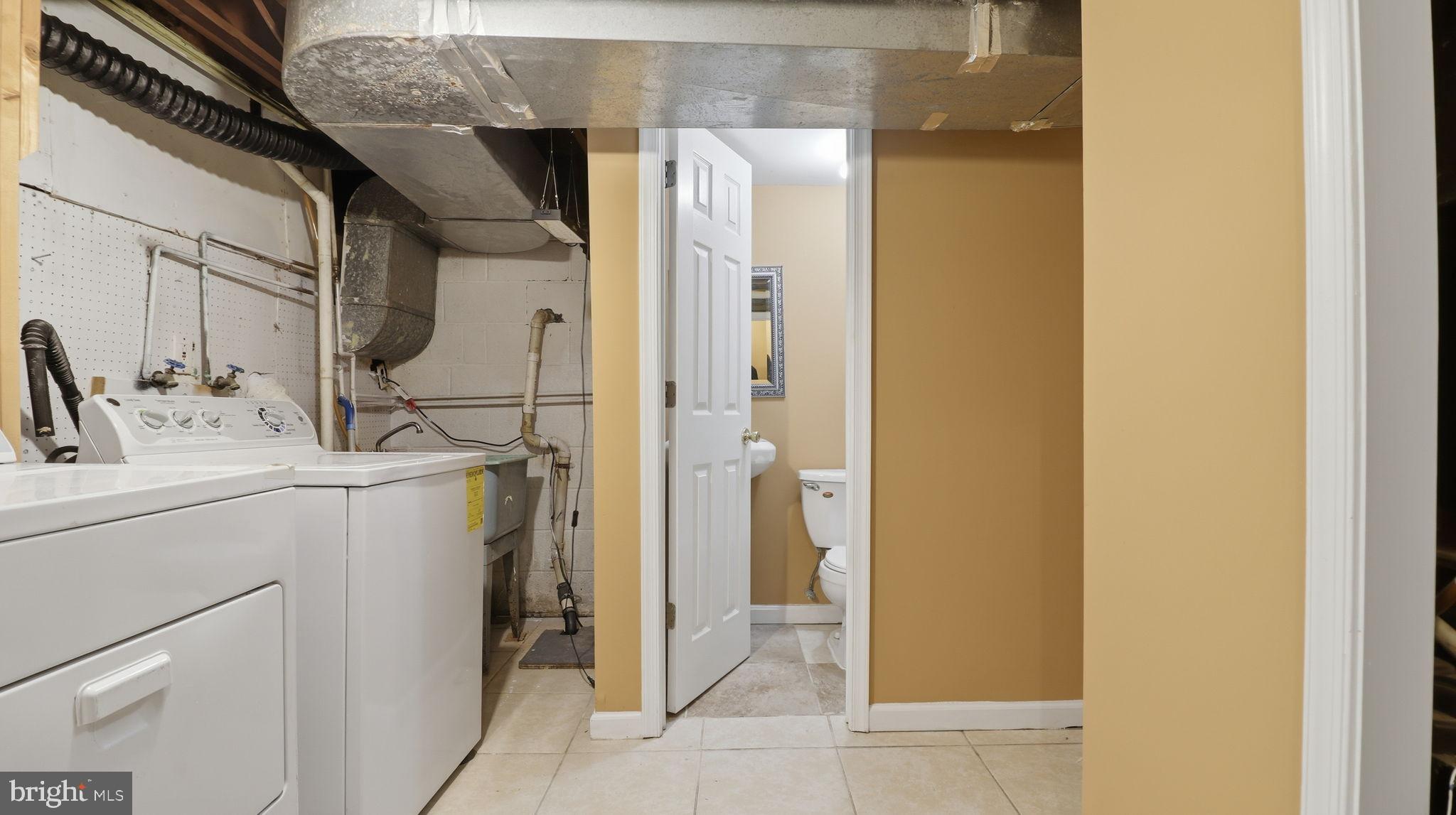 1703 Tioga Road Fort Washington, MD 20744 - Photo 53 of 57 Functional basement laundry and bathroom space.