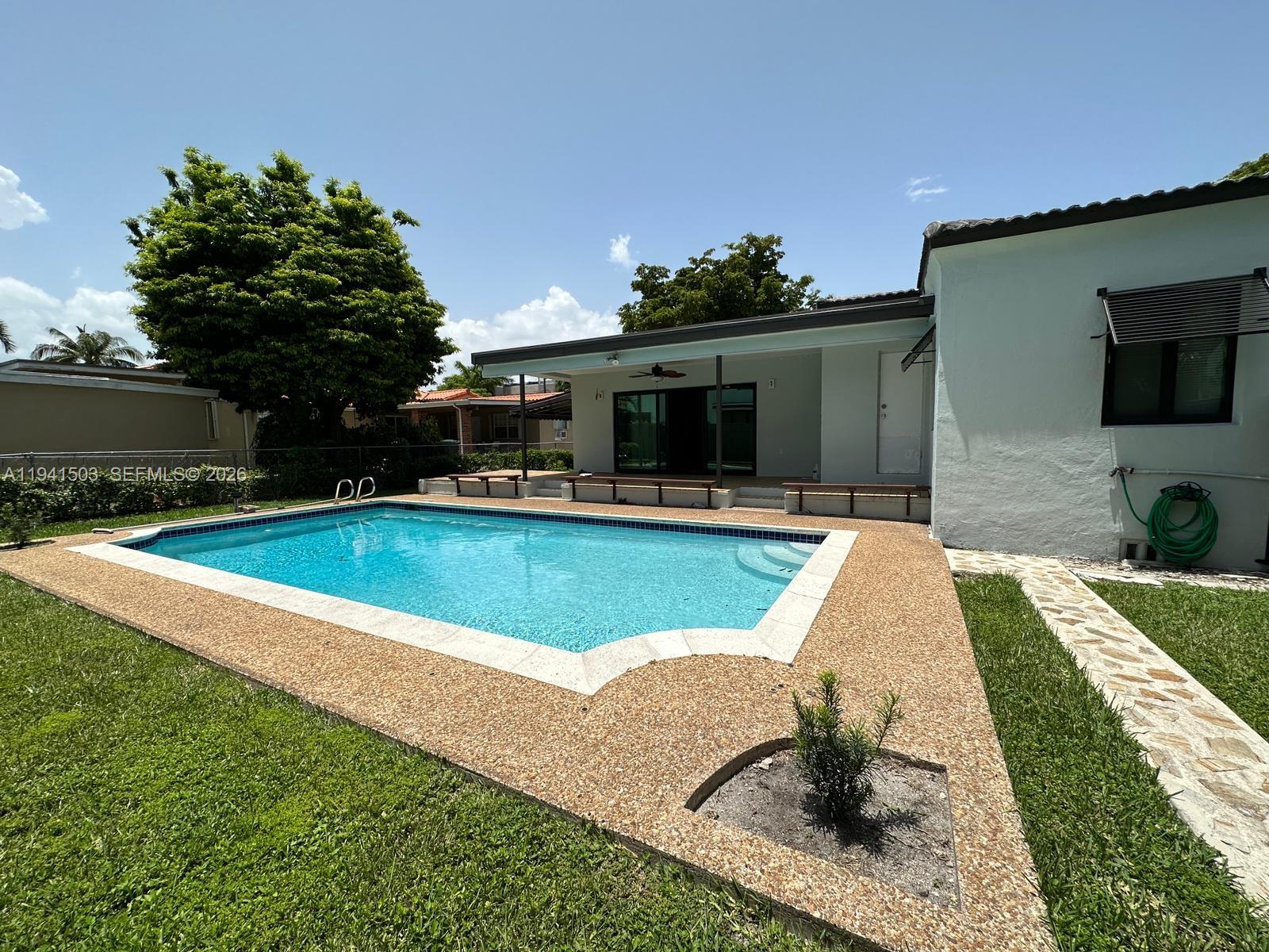 3050 Southwest 21st Street Miami, FL 33145 - Photo 16 of 38 a view of outdoor space yard swimming pool and porch