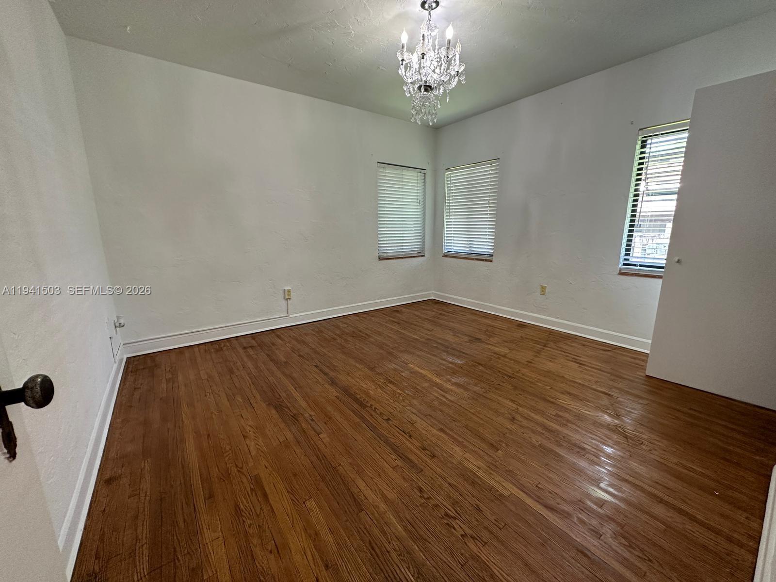 3050 Southwest 21st Street Miami, FL 33145 - Photo 30 of 38 wooden floor in an empty room with a window