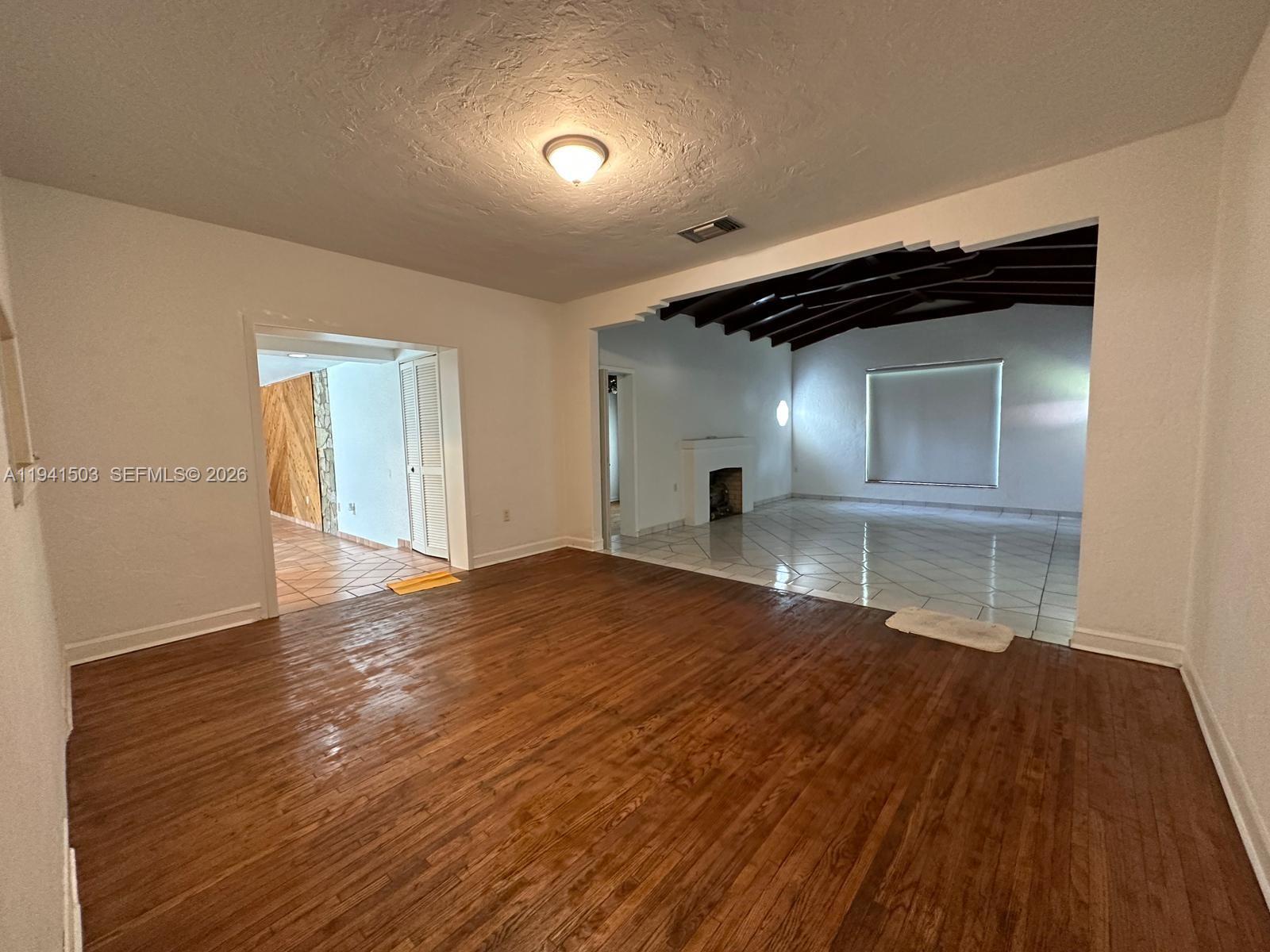 3050 Southwest 21st Street Miami, FL 33145 - Photo 37 of 38 a view of empty room with wooden floor