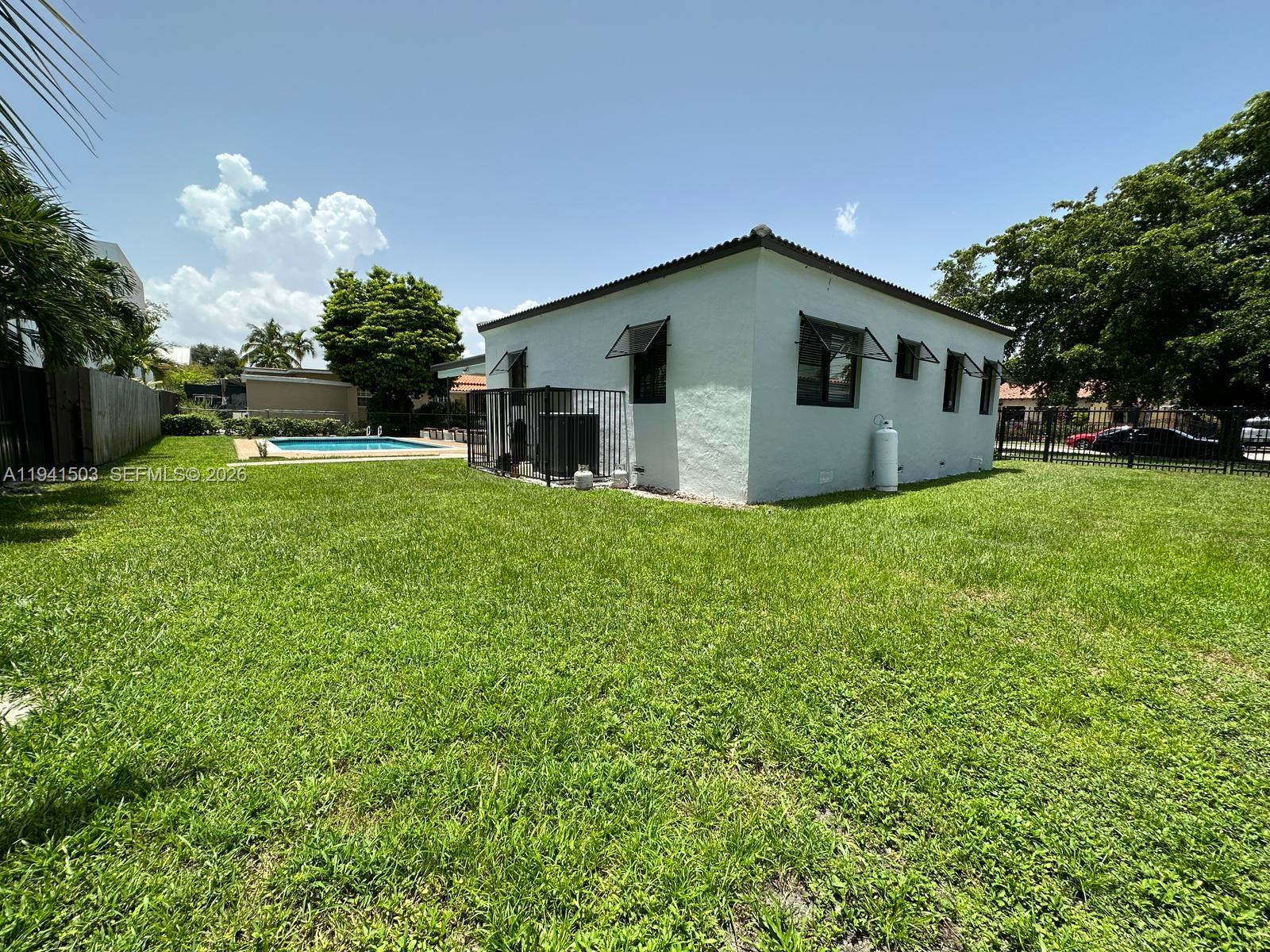 3050 Southwest 21st Street Miami, FL 33145 - Photo 9 of 38 a house view with a garden space