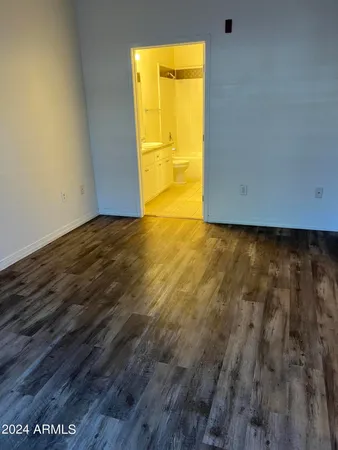 a view of an empty room and a window