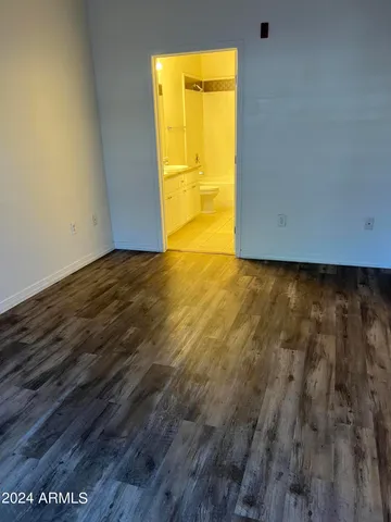 a view of an empty room and a window