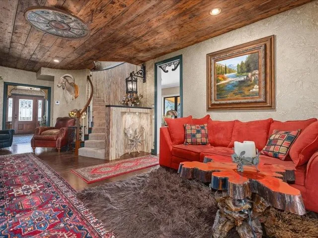 a living room with furniture and a rug