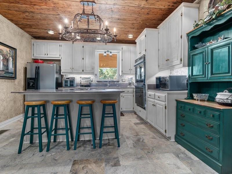 1847 Highway 19 Emory, TX 75440 - Photo 20 of 40 a kitchen with cabinets a sink and appliances