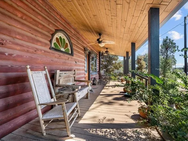 a view of a chairs and table in a patio