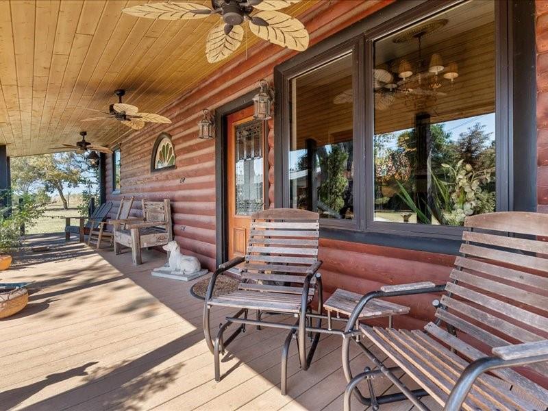 1847 Highway 19 Emory, TX 75440 - Photo 36 of 40 a view of a patio with table and chairs with wooden floor and fence