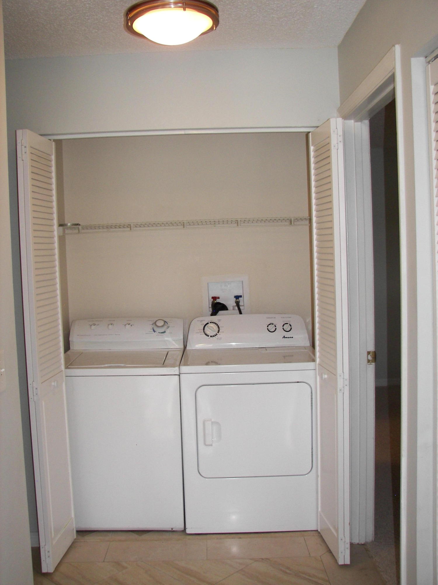 2827 Stoneway Lane, Unit D Fort Pierce, FL 34982 - Photo 13 of 25 a utility room with dryer and washer