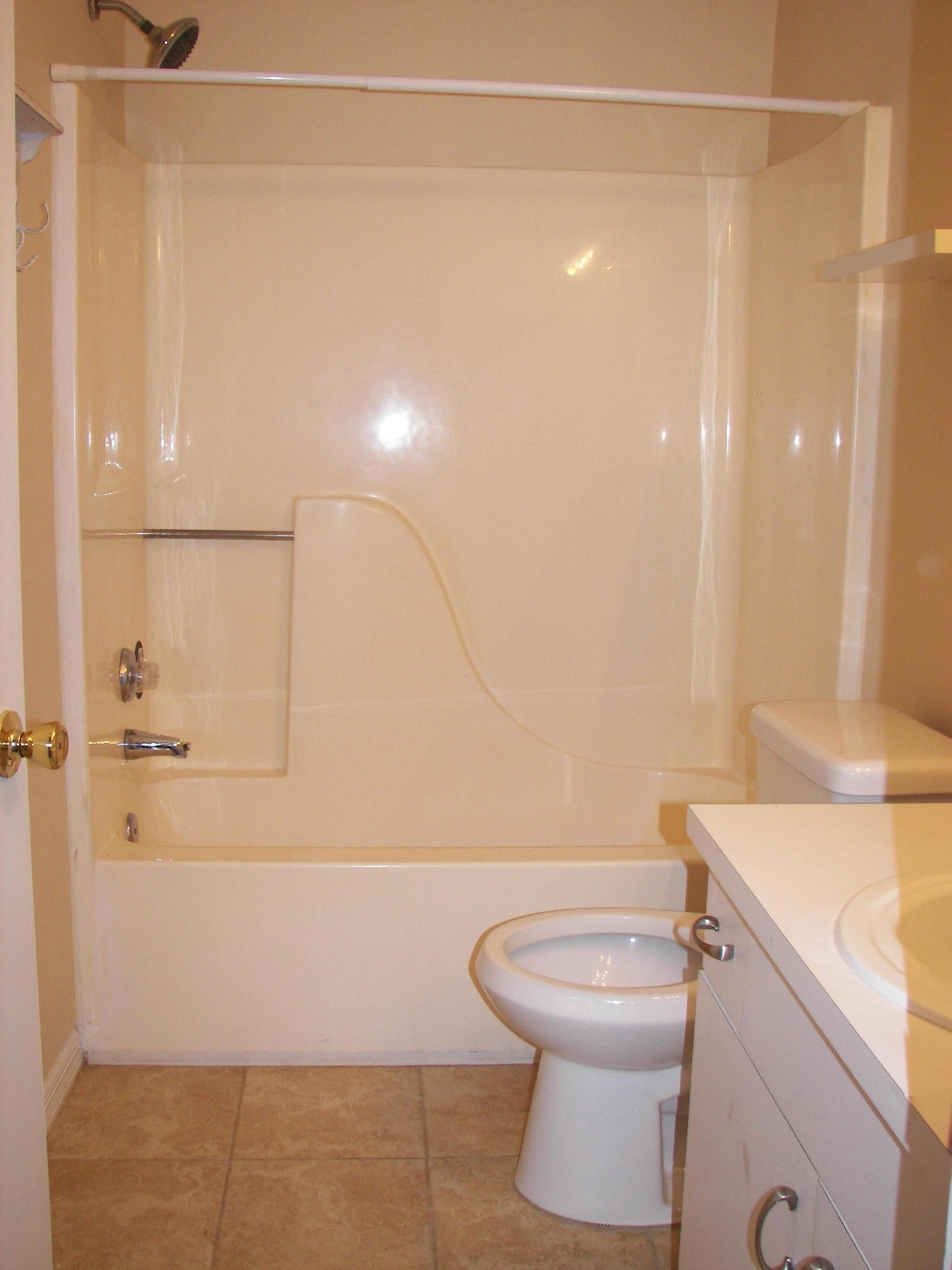 2827 Stoneway Lane, Unit D Fort Pierce, FL 34982 - Photo 17 of 25 a bathroom with a toilet a sink and a shower