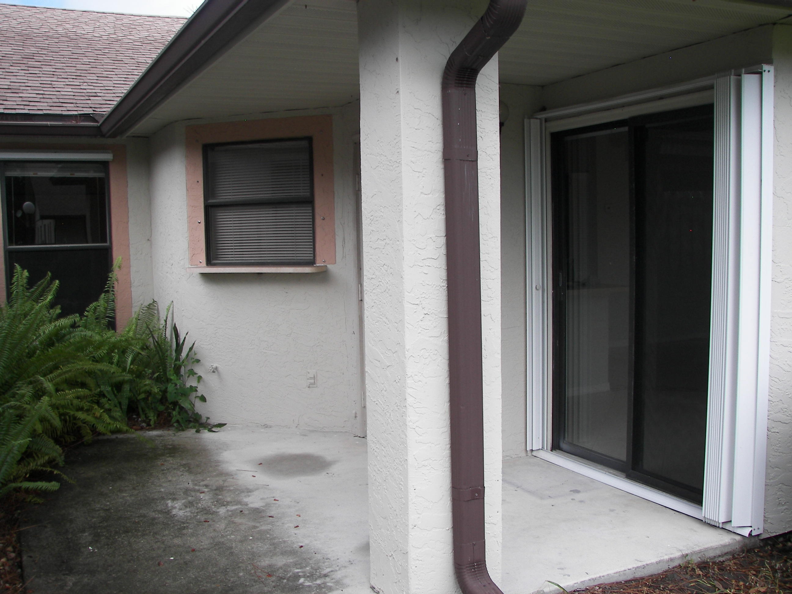 2827 Stoneway Lane, Unit D Fort Pierce, FL 34982 - Photo 18 of 25 a view of house with backyard