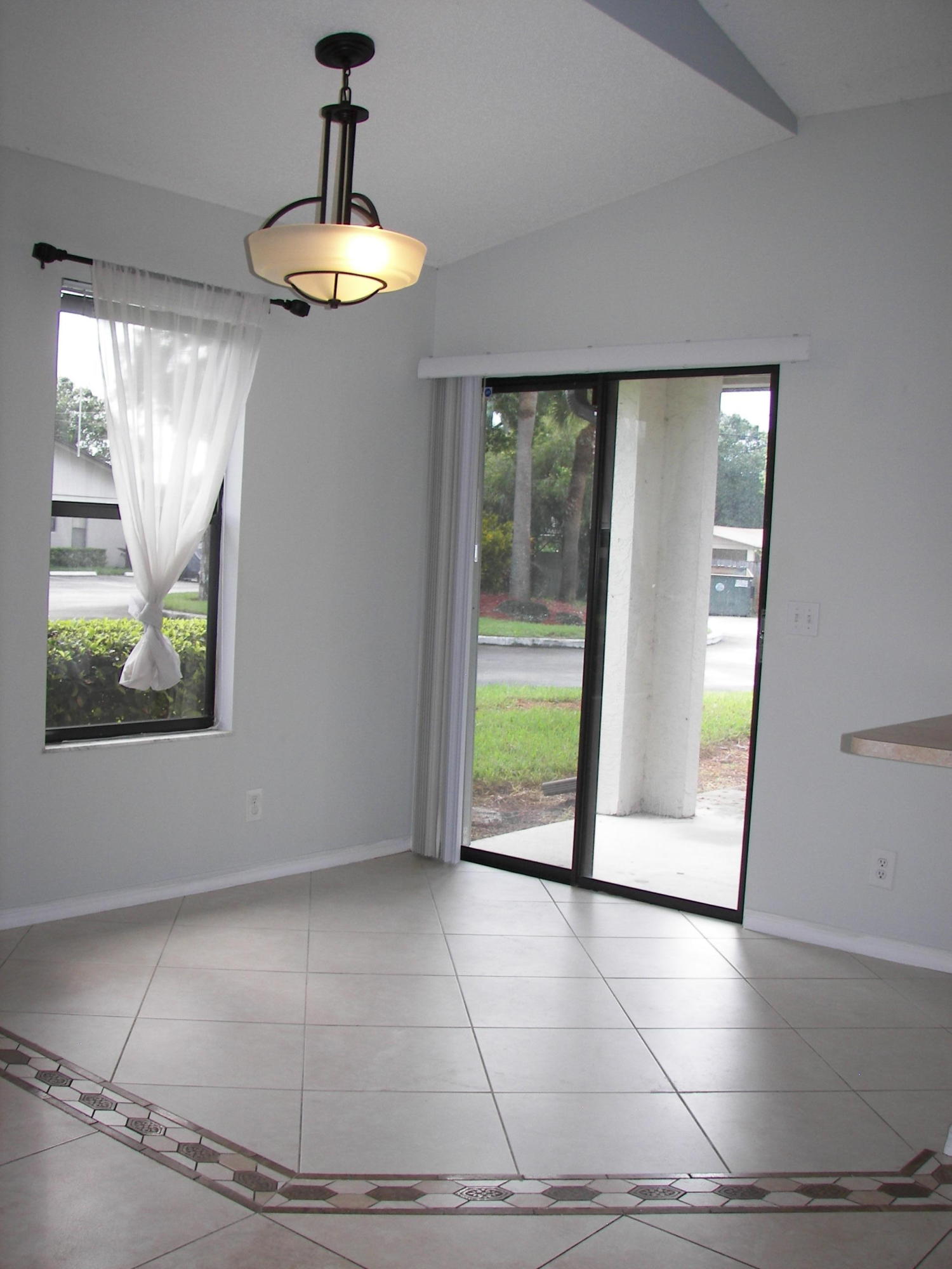 2827 Stoneway Lane, Unit D Fort Pierce, FL 34982 - Photo 4 of 25 a view of an empty room with a window
