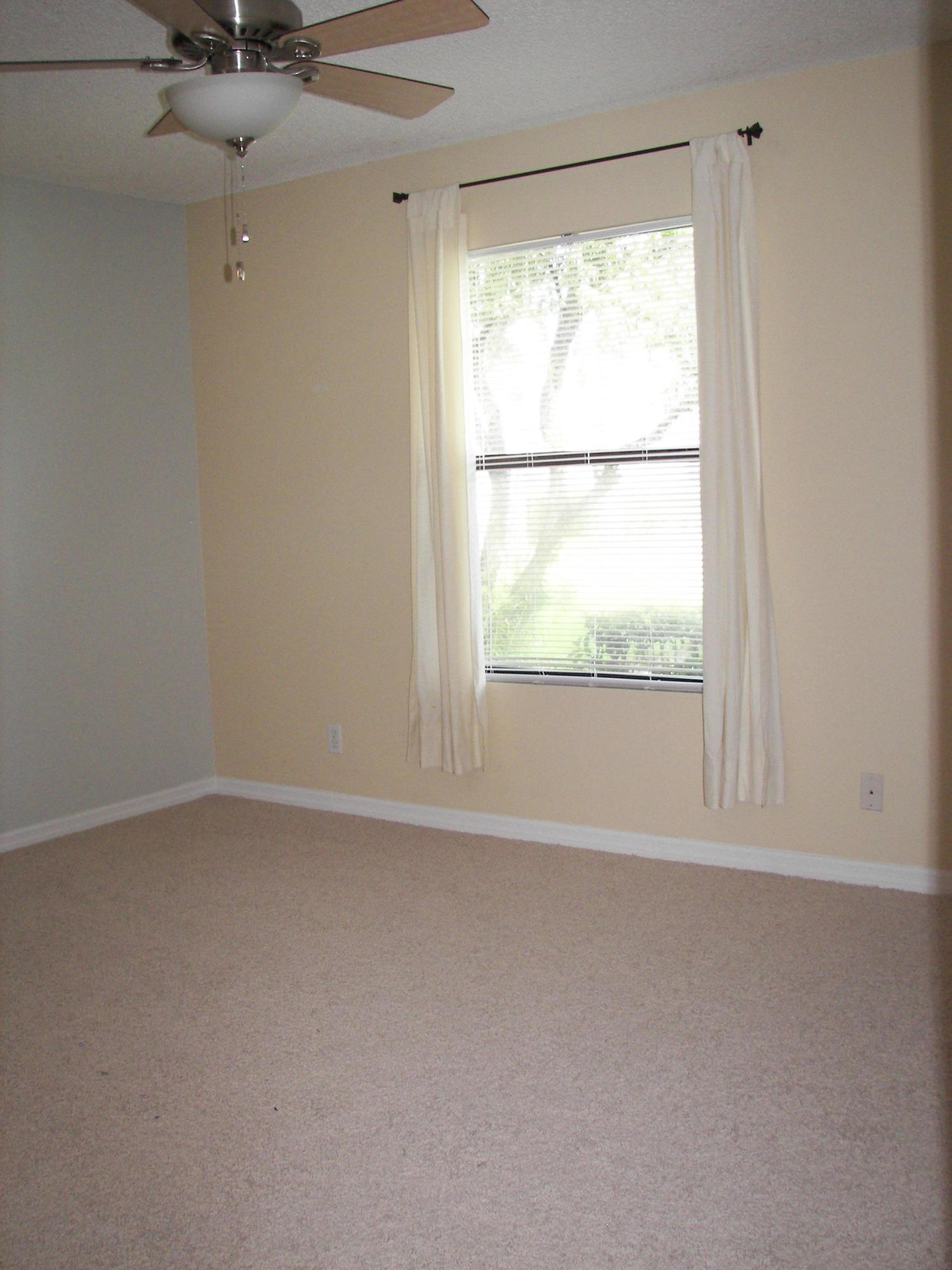 2827 Stoneway Lane, Unit D Fort Pierce, FL 34982 - Photo 8 of 25 an empty room with a window
