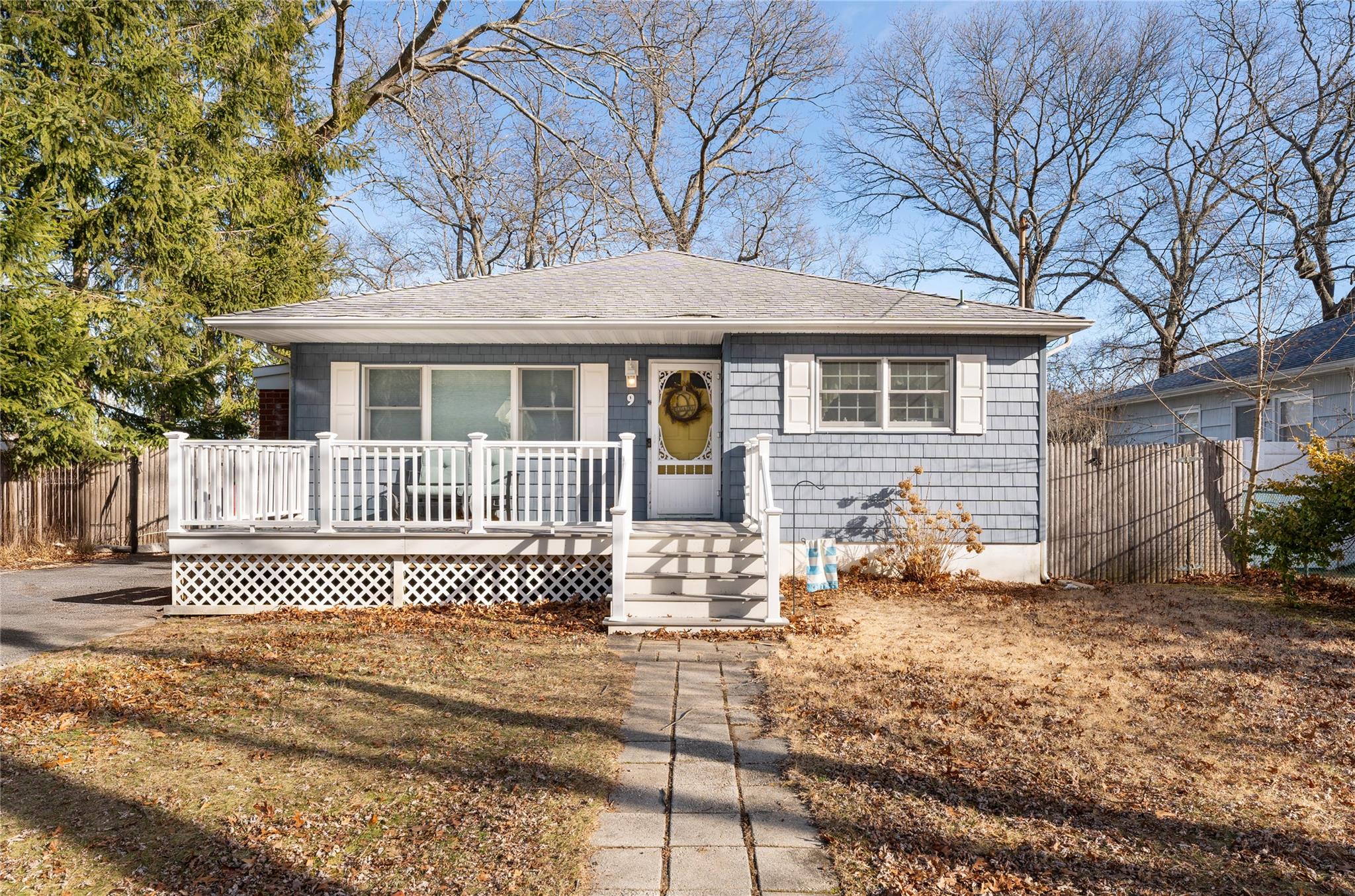 9 Forest Trail Ridge, NY 11961 - Photo 1 of 1 Bungalow-style home featuring a porch